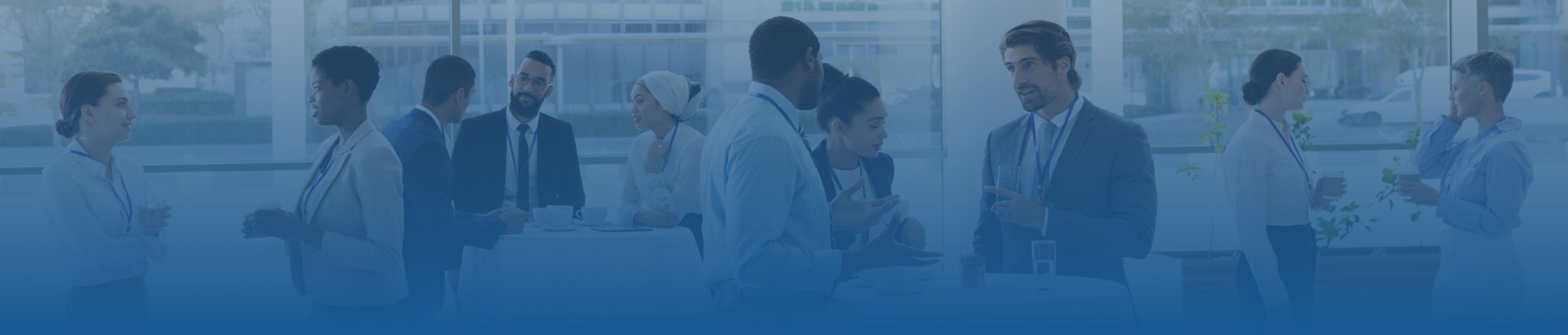 Blue tint frame that shows a work event going on with 4 different conversation groups